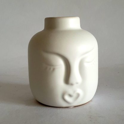 White face candle holder